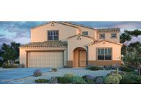 Charming two-story home featuring a desert-landscaped front yard, attached garage, and attractive architectural details at 5236 W Walatowa St, Laveen, AZ 85339