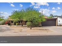 Charming single-story home with a two-car garage and mature trees in the front yard at 7226 E Virginia Ave, Scottsdale, AZ 85257