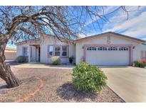 Charming single-story home featuring a well-maintained front yard and two-car garage at 918 E Lincolnwood Cir, Casa Grande, AZ 85194