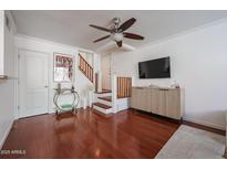 Bright living room with hardwood floors, modern ceiling fan and stylish furnishings at 1701 E Colter St # 10, Phoenix, AZ 85016