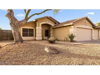 Charming single-story home featuring a desert landscape and a two-car garage at 21630 N 30Th Ln, Phoenix, AZ 85027