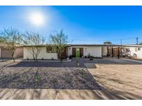 Charming single-story home featuring a desert landscape, and a bright green front door at 2324 N 40Th St, Phoenix, AZ 85008