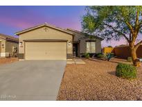 Charming single-story home featuring a two-car garage, xeriscape yard, and neutral paint scheme at 35751 N Bandolier Dr, San Tan Valley, AZ 85144