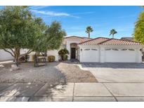Charming single-story home with a three-car garage, low-maintenance landscaping, and a beautiful tile roof at 721 W Cherrywood Dr, Chandler, AZ 85248