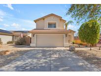 Charming two-story home with a large driveway and well-maintained front yard at 17473 N 167Th Dr, Surprise, AZ 85374