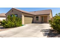 Charming single-story home showcasing a desert-landscaped front yard and a two-car garage at 2021 E Velvet Pl, Casa Grande, AZ 85122