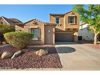 Charming two-story home featuring a desert landscaped yard and a two car garage at 2134 E Honeysuckle Pl, Chandler, AZ 85286