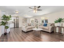 Inviting living room featuring hardwood floors, neutral walls, recessed lighting, and a ceiling fan at 320 E Mckellips Rd # 166, Mesa, AZ 85201
