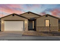 Charming single-story home with a two-car garage and desert landscaping at 3598 E Alexander Dr, San Tan Valley, AZ 85143