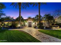 Beautiful single story home with mature trees and manicured lawn leading to a grand entrance at 8306 N Merion Way, Paradise Valley, AZ 85253