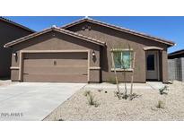 Charming single-story home with a low maintenance front yard and an attached two-car garage at 1082 W 20Th St, Florence, AZ 85132