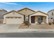 Charming one-story home featuring a two-car garage and low-maintenance landscaping at 1358 E Angie St, Casa Grande, AZ 85122