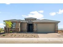Charming single-story home featuring a two-car garage, desert landscaping, and stone accents at 13769 W Whisper Rock Trl, Peoria, AZ 85383