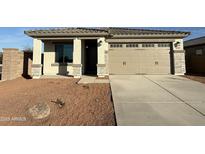 Charming single story home with a two car garage and low maintenance desert landscaping at 17422 W Las Palmaritas Dr, Waddell, AZ 85355