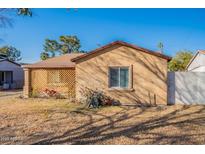 Charming home featuring a lattice-covered porch and a well-maintained yard at 2318 E Flower St, Phoenix, AZ 85016