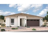 Beautiful single-story home with a modern design, featuring a brown garage door and desert landscaping at 5356 W Manzanita Dr, Glendale, AZ 85302