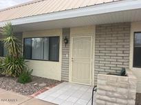 Inviting front entrance with well-maintained facade, tiled walkway and desert landscaping at 5518 E Lindstrom Ln # B3, Mesa, AZ 85215