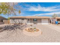 Charming single-story home featuring a low-maintenance front yard and attached one car garage at 7546 E Clovis Cir, Mesa, AZ 85208