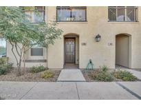 Charming townhome exterior featuring a private entrance, landscaped walkway, and balcony at 155 N Lakeview Blvd # 206, Chandler, AZ 85225