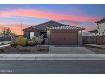 Charming single-story home with well-manicured landscaping and a two-car garage at 18153 W Fulton St, Goodyear, AZ 85338