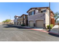 Charming townhomes feature two-car garages, neutral stucco exteriors and well-manicured landscapes at 7726 E Baseline Rd # 207, Mesa, AZ 85209