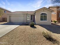 Charming single-story home with a two-car garage and low-maintenance landscaping at 1131 E Catino St, San Tan Valley, AZ 85140