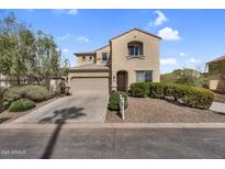 Charming two-story home featuring a two-car garage, neutral stucco exterior, and low maintenance desert landscaping at 1236 E Mescal St, Phoenix, AZ 85020