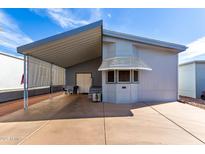 Charming single-story home with covered carport and awning over the front windows at 17200 W Bell Rd # 1628, Surprise, AZ 85374