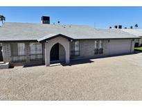 Charming single-story home with desert landscaping and an arched entryway at 18250 N 30Th N Ln, Phoenix, AZ 85053