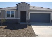 Attractive single-story home with a tidy stone-accented facade, desert landscaping, and an attached two-car garage at 18875 E Bruno Dr, Gold Canyon, AZ 85118