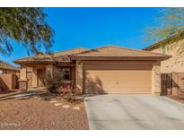 Charming single-story home with desert landscaping, large garage and tile roof at 25714 W St Catherine Ave, Buckeye, AZ 85326