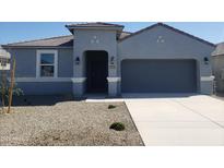 Charming single-story home with a gray exterior, covered entry, and two-car garage at 48467 N Duran Way, Gold Canyon, AZ 85118