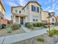 Charming two-story home with landscaped yard and neutral color palette in a desirable neighborhood at 14247 W Bronco Trl, Surprise, AZ 85387