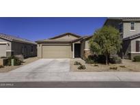 Charming single-story home featuring a two-car garage and well-maintained desert landscaping at 36602 W San Alvarez Ave, Maricopa, AZ 85138