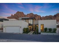 Stunning contemporary home with a sleek design and beautiful desert landscaping at 5935 N Echo Canyon Ln, Phoenix, AZ 85018