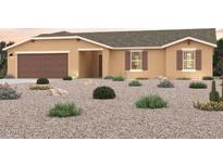 Charming single-story home featuring a two-car garage and desert landscaping at 10856 W Torren Dr, Arizona City, AZ 85123