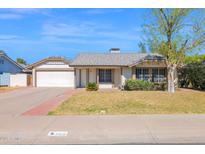 Charming single-story home with a well-manicured front yard and attached two-car garage at 1166 E Del Rio St, Chandler, AZ 85225