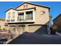 Inviting multi-story home with three-car garage, balcony, and landscaped surroundings at 2150 E Bell Rd # 1048, Phoenix, AZ 85022