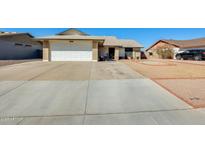 Charming single-story home featuring a two-car garage and well-maintained front yard in a quiet neighborhood at 2202 N Los Altos Dr, Chandler, AZ 85224