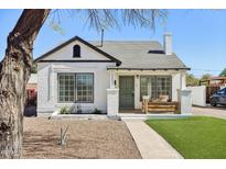 Charming white brick home with a manicured front yard and covered porch at 2237 N 9Th St, Phoenix, AZ 85006