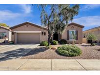 Charming single-story home with desert landscaping, a two-car garage, and a cozy, inviting curb appeal at 5165 S Peach Willow Ln, Gilbert, AZ 85298