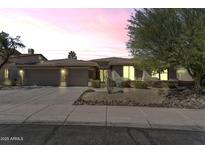 Charming single-story home featuring a three car garage and desert landscaping at 7686 S Myrtle Ave, Tempe, AZ 85284