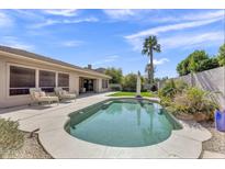 Inviting backyard pool area featuring lounge chairs and a well-maintained patio, perfect for relaxation and outdoor enjoyment at 7686 S Myrtle Ave, Tempe, AZ 85284