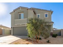 Charming two-story home featuring a two-car garage and low-maintenance desert landscaping at 22962 N 182Nd Ln, Surprise, AZ 85387