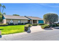 Charming single-story home with a well-manicured lawn and a neatly landscaped front yard at 2919 W Kerry Ln, Phoenix, AZ 85027