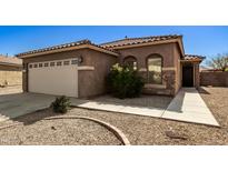 Charming single-story home with a two-car garage and well-maintained landscaping at 2977 W Mira Dr, San Tan Valley, AZ 85144