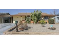 Charming home featuring desert landscaping with various cacti and a secure mailbox at 4428 W Mission Ln, Glendale, AZ 85302