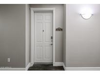 Apartment front door entrance with white door and dark floors at 5350 E Deer Valley Dr # 2246, Phoenix, AZ 85054