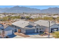 Beautiful single-story home featuring a two-car garage, mountain views, and tile roof at 7751 W Forest Grove Ave, Phoenix, AZ 85043