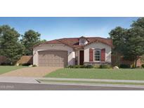 Charming single-story home featuring a 2-car garage, neutral stucco, and a brick-paved driveway leading to a lush green lawn at 1482 W Ridge Rd, Apache Junction, AZ 85120
